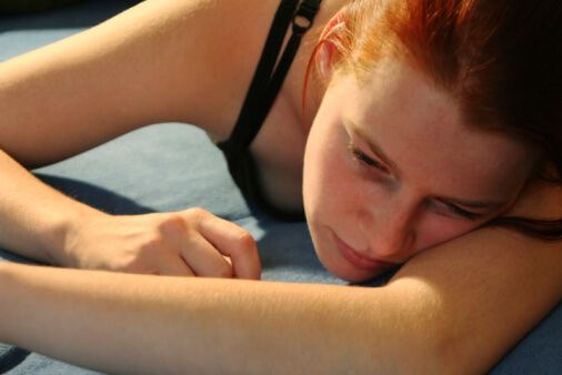 girl lying on floor knows about heroin addiction statistics