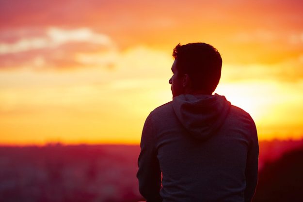 a man looking at the sunset thinking about his relapse prevention guide