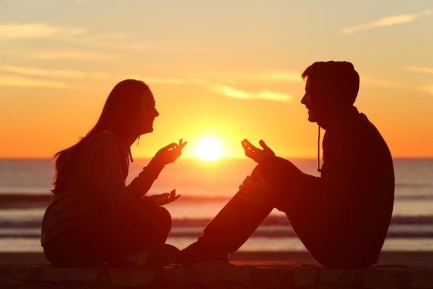 couple sitting during sunset one has a heroin addiction