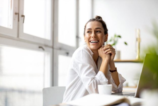 woman smiling and overcoming addiction