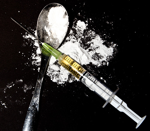 spoon, needle and powder indicate Heroin Addiction