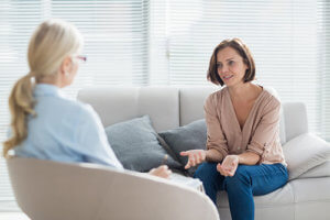 woman talks to her therapist at a Portland Rehab