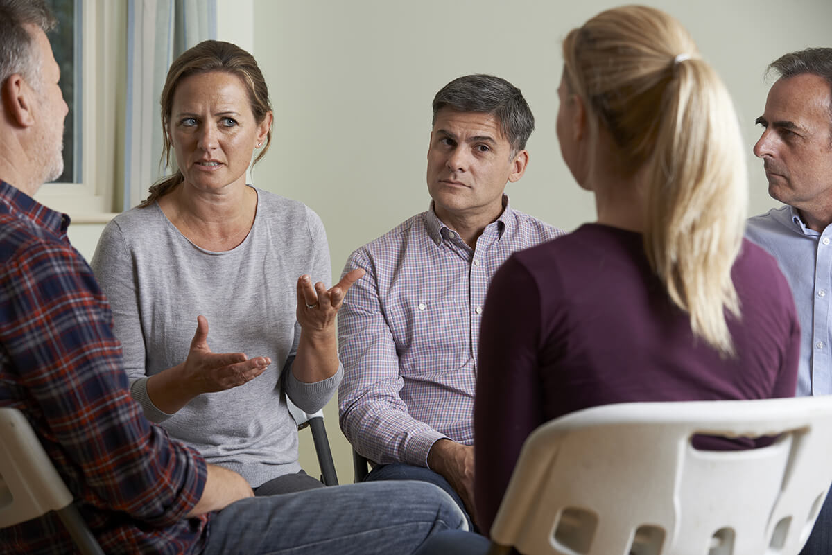 woman speaking in a group therapy program in an outpatient drug rehab vancouver wa