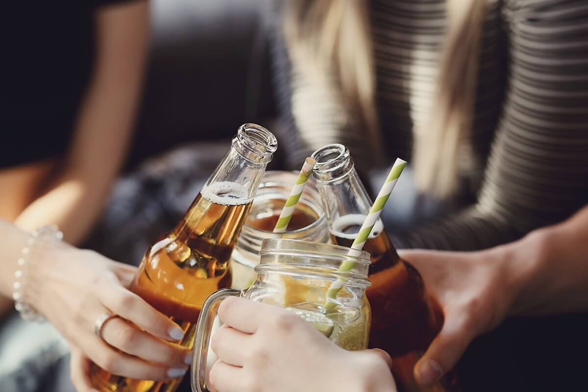 Group of young people with beers makes you wonder why do teens drink?