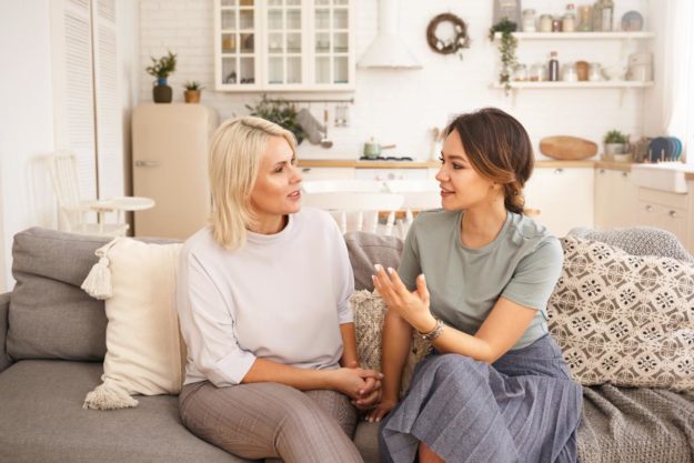 women holding an alcohol intervention