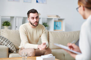 a man talking to his doctor at a Bend Oregon Drug Rehab Center