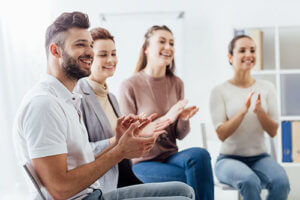 a group therapy session welcoming a new member at Grants Pass Oregon Drug Rehab Center