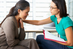 a woman talking to her doctor at a Drug Rehab Center near Anacortes