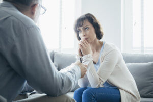 a woman talking to her therapist at a Drug Rehab Center near Bainbridge