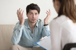 a man confused by a doctor suggestion at a Drug Rehab Center near Redmond