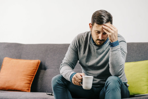 a man drinking coffee wondering what is salvia