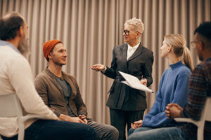 Alcohol Rehab Center near Bainbridge, patients listening to therapist