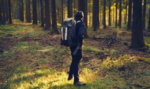 client at drug rehab center near Benton City, Washington hiking through the woods