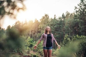 woman taking in the nature around a drug rehab center near Tigard, Oregon