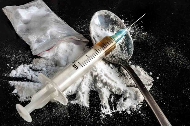 A needle and spoonful of heroin beg the question is heroin a narcotic