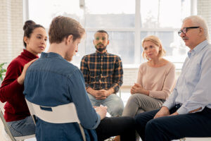 a group of people talk at a heroin rehab center near Redmond