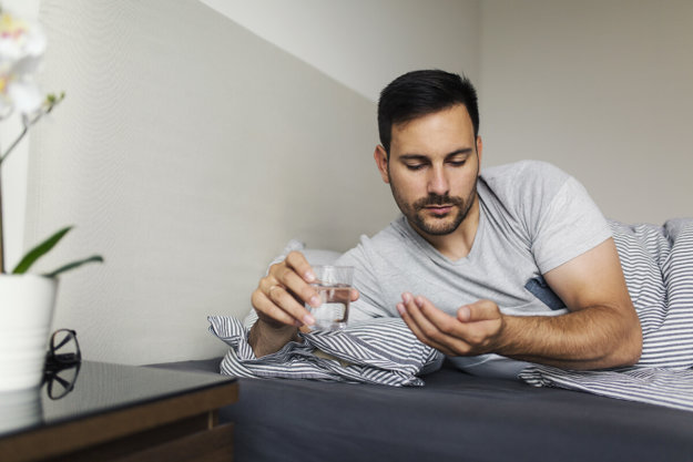 a man looks at pills and wonders what is codependency