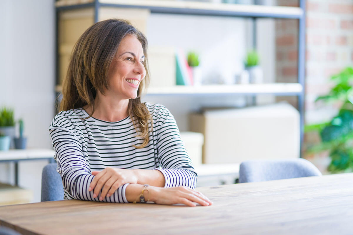 a woman smiles after benefiting from individualized care