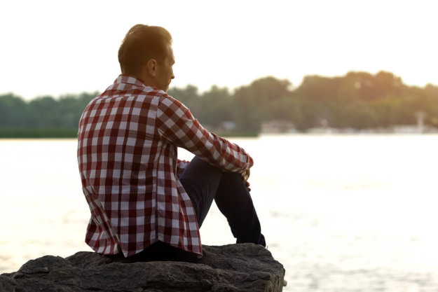 man thinking about the cycle of addiction