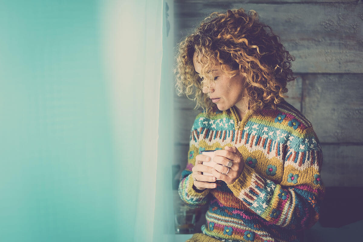 woman thinking about what are causes of addiction