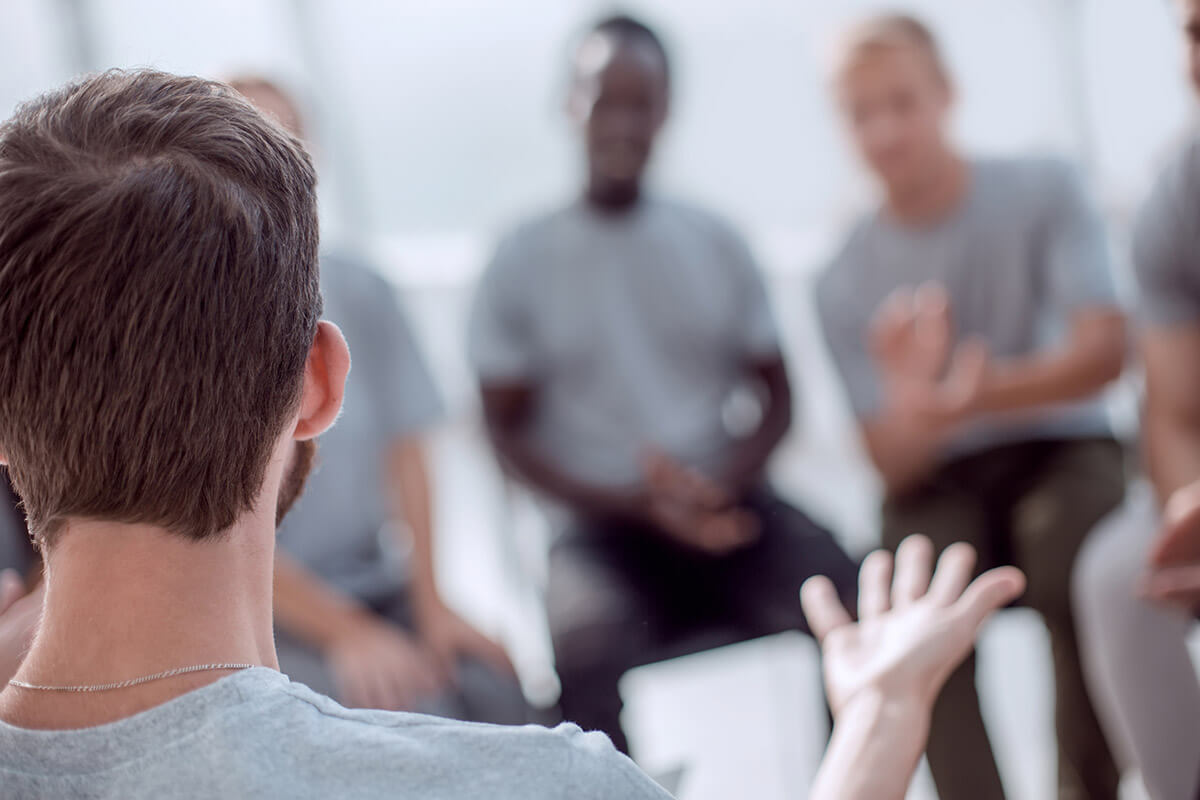 group at a men's opioid rehab program