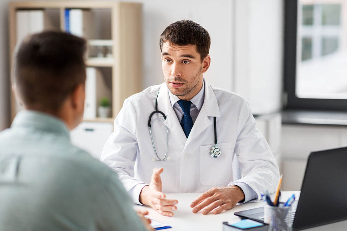 doctor and a patient learning more about alcohol liver damage