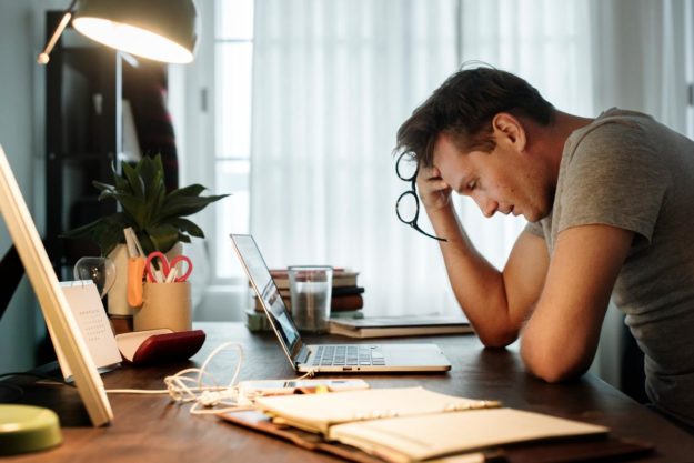 Man thinking about signs of dissociative disorder