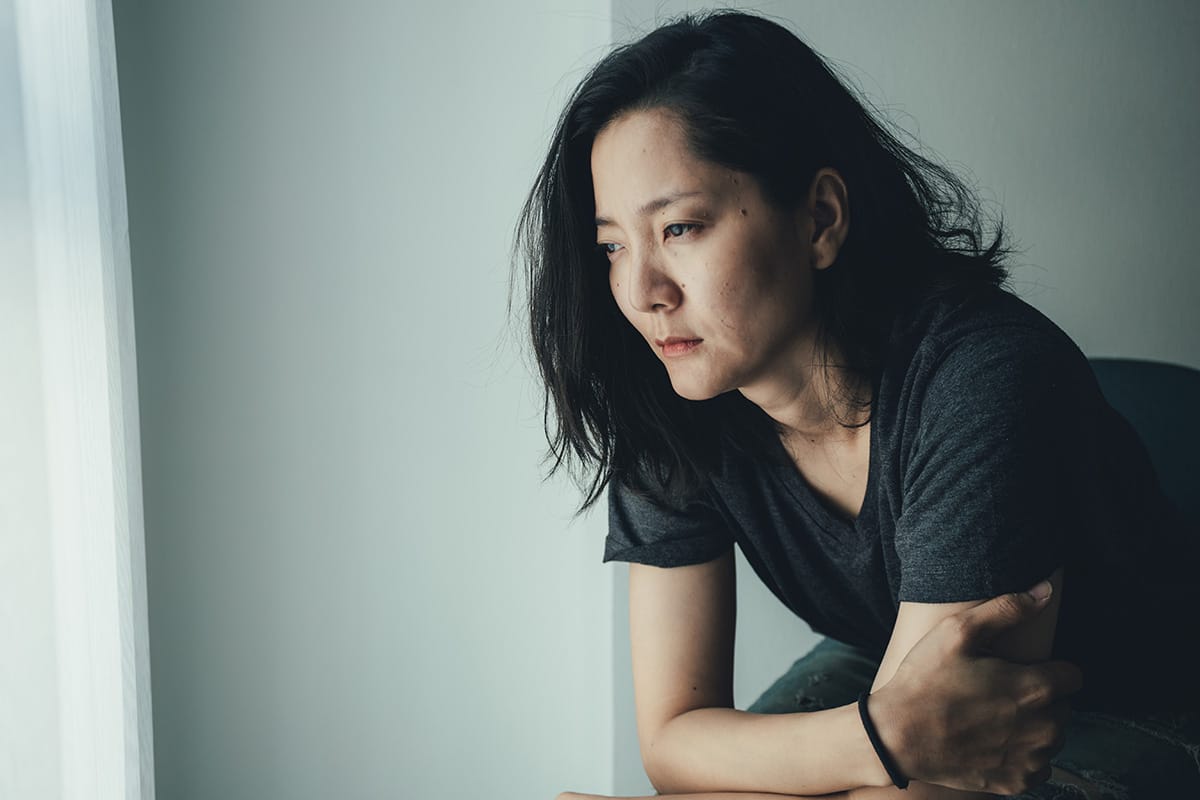 Woman deep in thought about mental health disorders