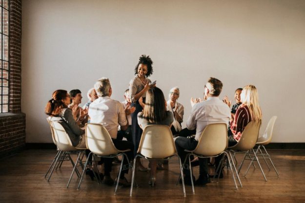 A group of people enjoying the benefits of group therapy