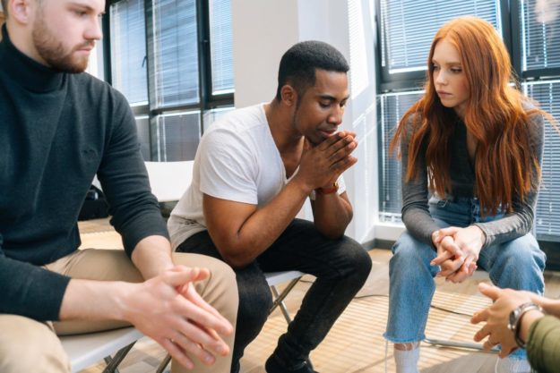 Group of people attempting to learn anger management skills