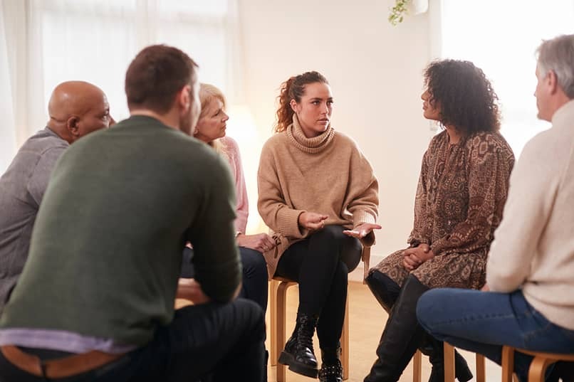 woman sharing in aa group meeting