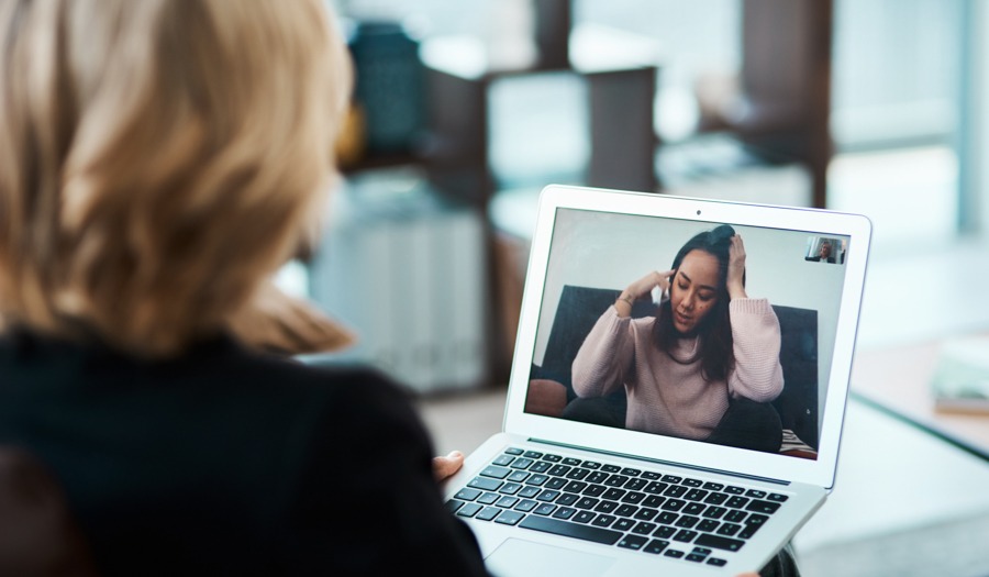 therapist on telehealth call with patient