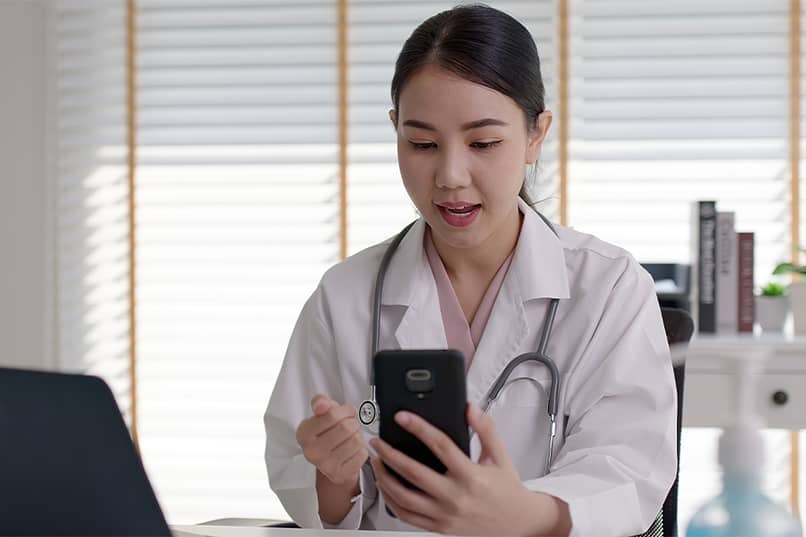 doctor on telehealth call using cellphone