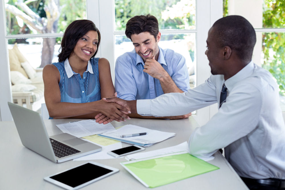 three business professionals working on a project