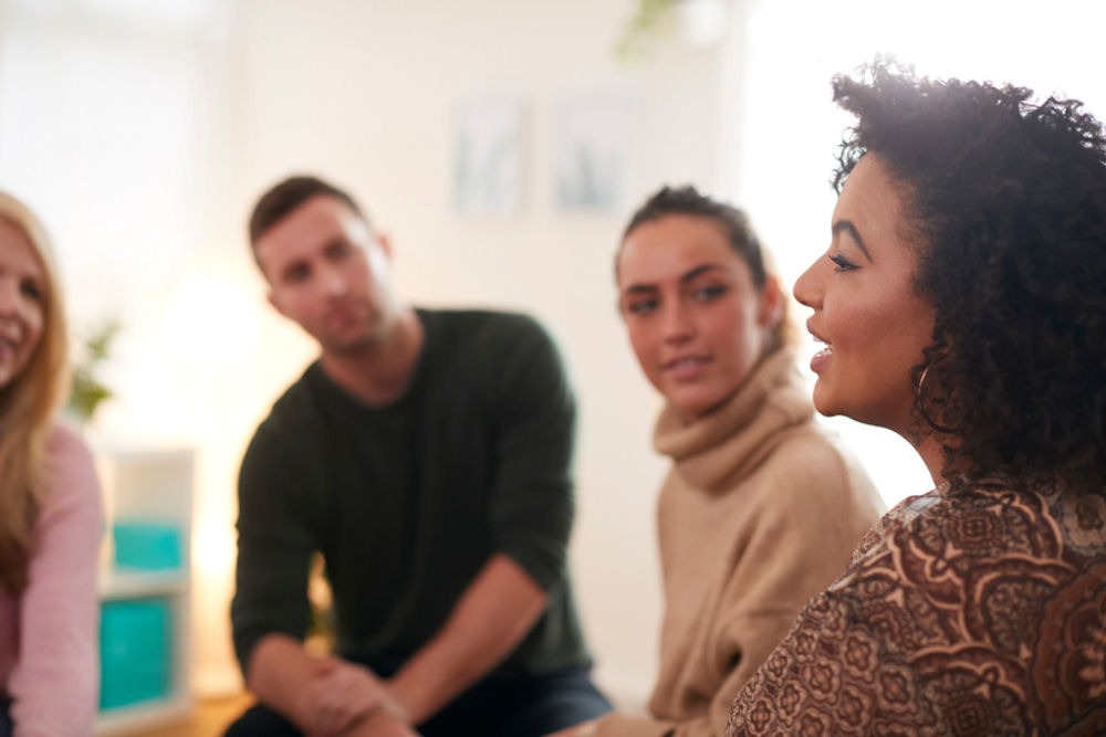 woman in recovery sharing story in support group