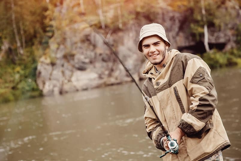 man fishing at a lake