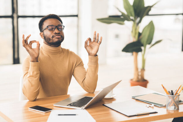 man taking a moment to relax while working from home