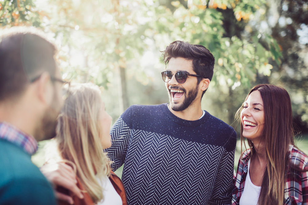 friends smiling and talking to each other