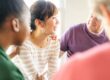 woman receiving support in group therapy