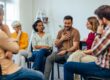 man getting emotional in group therapy