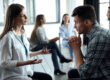 man and woman having a discussion about boundaries in group meeting